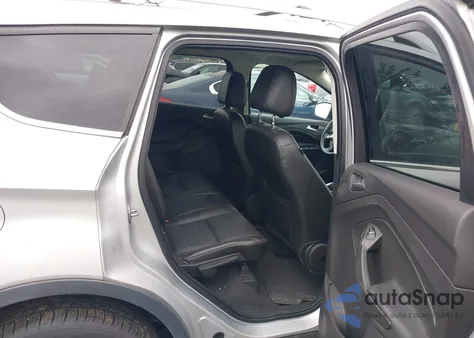 2014 Ford Escape Titanium z USA, uszkodzony, nr VIN 1FMCU9J99EUD98310